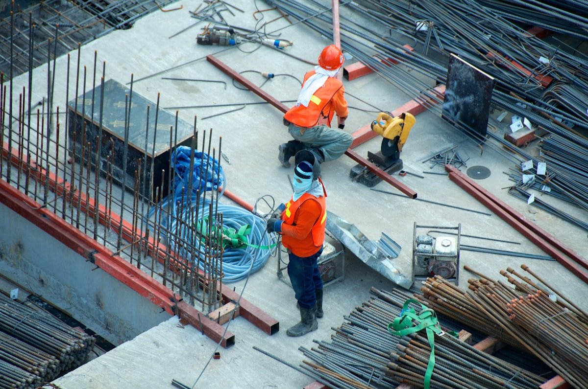 Commercial contractor performing mechanical diamond grinding and surface preparation on industrial concrete slab